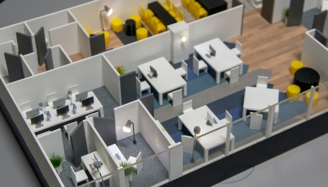 Maqueta de oficinas con muebles